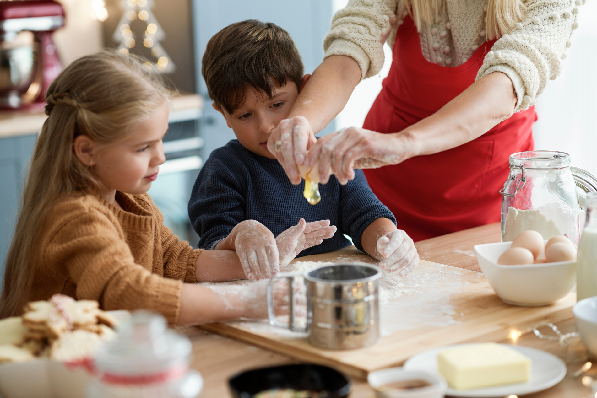 Mother and Kids Baking Gingerbread Cookies
