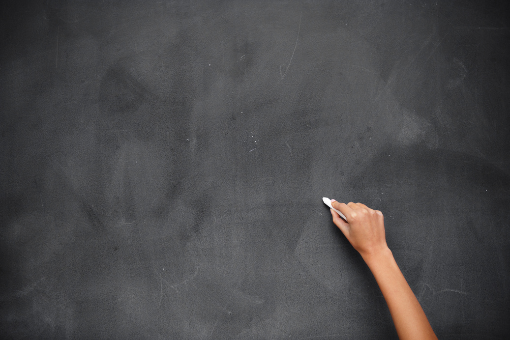 Hand writing on chalkboard